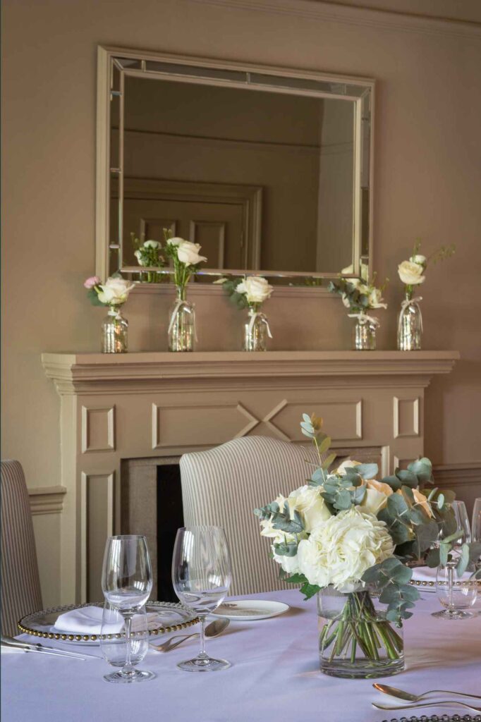 Wedding dinner table details featuring flowers