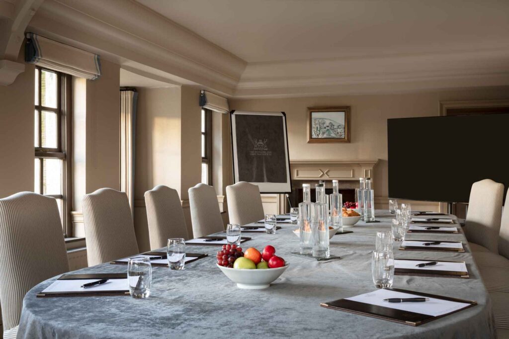wide meeting room shot of a table ready for a corporate meeting