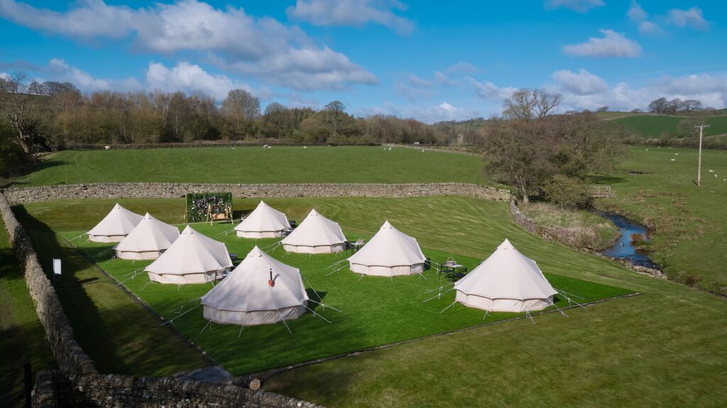 The Spa tents outside with the outdoor tables and chairs.